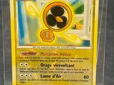 a close up of a pokemon card in a plastic box