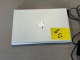 a laptop with a sticker on it sitting on a table