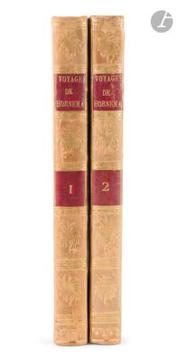 two old books sitting on top of each other on a white surface