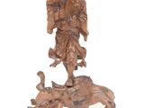 an image of a statue of a man on a horse with a bird