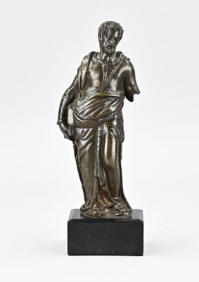 an image of a bronze statue of a man holding a bag