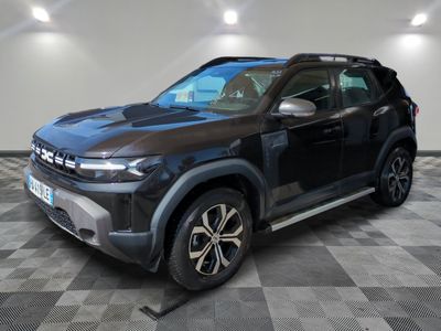 the black suv is parked on a checkered floor in a garage