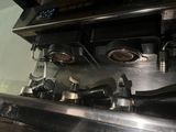 a close up view of a stove top with pots and pans on it