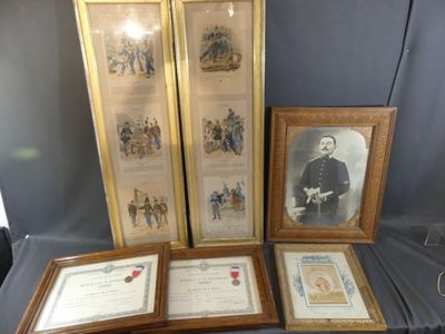 three framed pictures of men in military uniforms are on a table