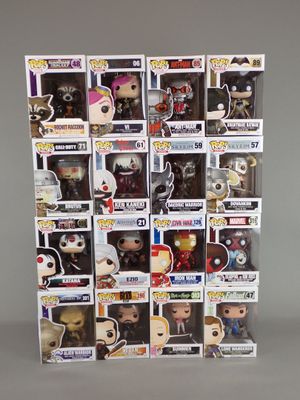 a close up of a bunch of pop vinyl figures in a display case