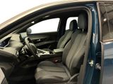 the interior of a car with the door open and the driver ' s seat down