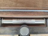 a metal object that is sitting in a wooden box