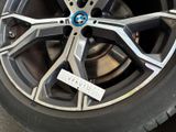 a close up of a car tire with a sticker on it