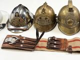 five different types of helmets and a hat on a table