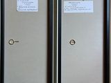 two framed pictures of a door with a key on it