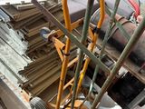 an image of a room with a couch and a cart full of wood