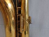 a gold saxophone that is sitting on a table