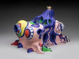 a colorful sculpture of a fish with a crown on it ' s head