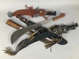 three different types of knives on a white surface