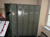two lockers in a room with a desk and a window