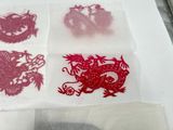 four different types of paper cut designs on a table