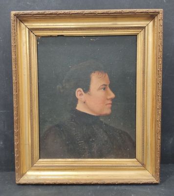 portrait of a man in a black shirt and a gold frame