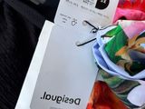 a bunch of clothes that are sitting on a table