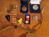 a wooden table with medals and other items on it