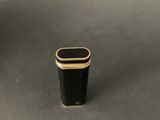 an image of a small black and gold box sitting on a table