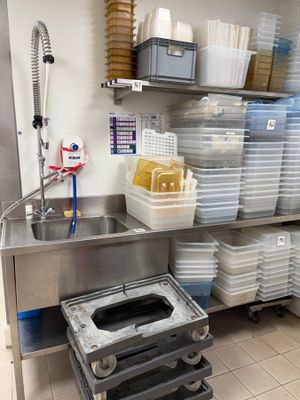 a kitchen with a lot of dishes on the shelves