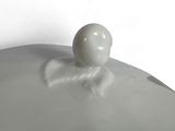 a white object sitting on top of a white plate
