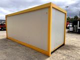 an image of a yellow and white container in a parking lot