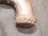 a close up of a metal object on a cloth