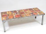 a table that has a tile top on it