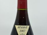 a bottle of wine that is sitting on a table