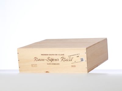 a wooden box with a label on it on a table
