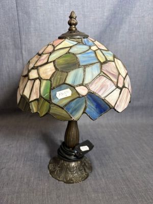 a close up of a lamp on a table with a gray background