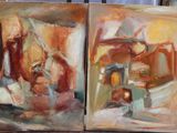 painting of a couple of paintings sitting on top of a table next to each other