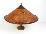an image of a bamboo hat with a gold ring on top