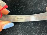 a person holding a pair of scissors in their hand