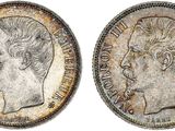 a silver coin with an image of a man ' s head on it