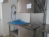 an image of a kitchen with a sink and a refrigerator