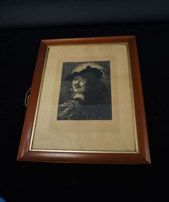 an old picture of a woman wearing a hat and holding a cane