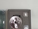 a box with a cd in it sitting on a table