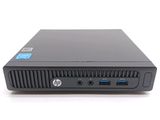 the back of a small black computer with a blue sticker on it
