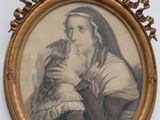 une vieille photo d'une femme tenant un chat dans ses bras