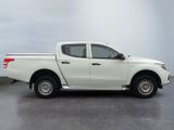 a picture of a white pick up truck parked in a parking lot