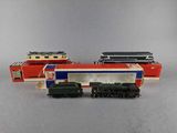 three toy trains sitting next to each other on a table