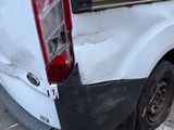 a white van that has been vandalized and is parked in a parking lot