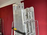 a lot of metal ladders stacked on top of each other