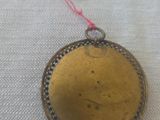 a close up of a metal object with a tag on it