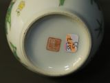 a close up of a vase with a sticker on it