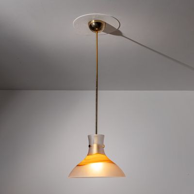 a close up of a light fixture hanging from a ceiling