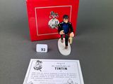 a small figurine of a man on a skateboard
