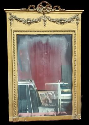 a picture of a mirror with a reflection of a car in it